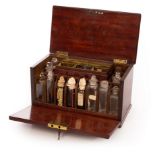 An apothecary's mahogany cabinet, 19th Century, the hinged cover with countersunk brass handle,