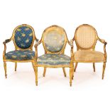 A set of three George III giltwood open armchairs,