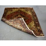 A Heriz rug,