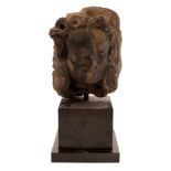 A 14th/15th Century carved stone head, probably French, modelled as a saint with long hair,