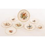 A Royal Worcester circular tea pot stand painted a chaffinch,