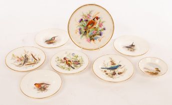 A Royal Worcester circular tea pot stand painted a chaffinch,