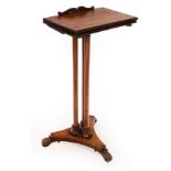 A William IV rosewood reading stand/table, the folding top with pull out supports and book rest,