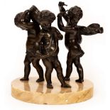 A bronze group, musical putto on a marble base,