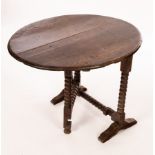 A Charles II oak coaching table, with oval tip-up top on bobbin turned legs and stretchers, 76.