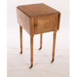 A pine two-flap bedside cupboard on turned legs,