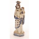 An 18th Century faience figure of the Virgin and Child, perhaps Nevers,