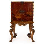 An 18th Century red japanned cabinet on stand, the chest decorated figures,