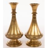 A pair of Mughal bronze tapering vases with circular stepped bases, 22.