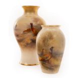 A Royal Worcester baluster vase painted pheasants in a wooded landscape, by James Stinton, signed,