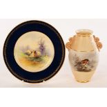 A Royal Worcester vase painted a robin in holly by H Stinton, the fluted body with serpent handle,