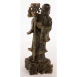 A Chinese jade figure of Shoulao, early 20th Century, standing on a plinth,