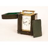 A gilt brass half-hour repeat carriage clock with rectangular brass dial, striking on a gong,