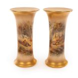 A pair of Royal Worcester waisted cylindrical vases,