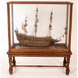 A scale model of a man-o-war, Sovereign of the Seas 1637, in a glazed case on stand,