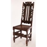 An early 18th Century English high-backed carved oak side chair,