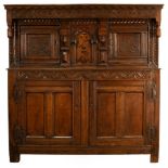 A mid 17th Century and later English oak inlaid court cupboard,
