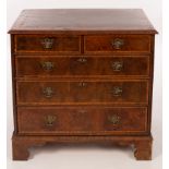 A George I figured walnut and holly banded chest,