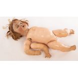 A German bisque head doll with sleepy eyes,