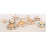 Poole Pottery, four floral lidded bowls, 12cm diameter, three smaller lidded bowls,