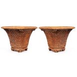 A pair of large terracotta vases with lattice decoration, 70cm high,