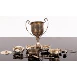 Four silver salts, a silver mustard pot, a silver prize cup, six silver spoons and two other pieces,