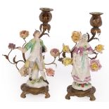 A pair of late 19th Century Continental porcelain mounted candelabra,