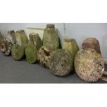 Six staddle stones with tapered bases,