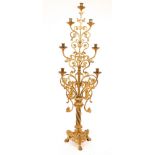 A gilt metal candle stand, with six-branches and seven-lights, 115.