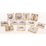 A collection of twelve 18th Century Delft blue and white tiles, decorated figures,