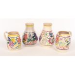 Poole Pottery, two floral vases marked 337, both with printed mark, 25cm high and two floral jugs,