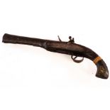 A 19th Century Indian flintlock pistol with a 10" octagonal barrel,