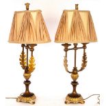 A pair of Empire style bronzed metal table lamps,