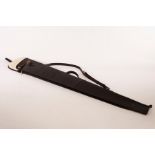 A leather gun slip with wool lining,