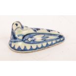 A 19th Century Persian recumbent duck, blue and white,