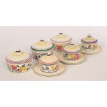 Poole Pottery, three floral butter dishes with lids,