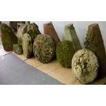 Six staddle stones with tapered bases,