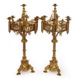 A pair of Gothic Revival style brass table candelabra,