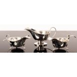 A pair of silver sauce boats, Viners, Sheffield 1958/65, another sauce boat and two sauce ladles,