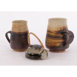 Mary Rich (born 1940), a miniature stoneware teapot with cane handle and two stoneware coffee mugs,
