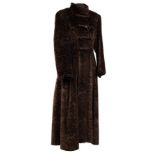 A Nina Ricci long dark brown faux astrakhan coat with frogging fastenings to the front,