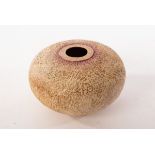 Philip Evans (born 1959), a spherical vessel with textured surface, gold and pink glazes,