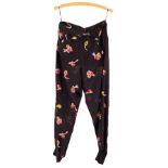 A pair of Sonia Rykiel silk trousers, polychrome sprays of flowers on a black ground,