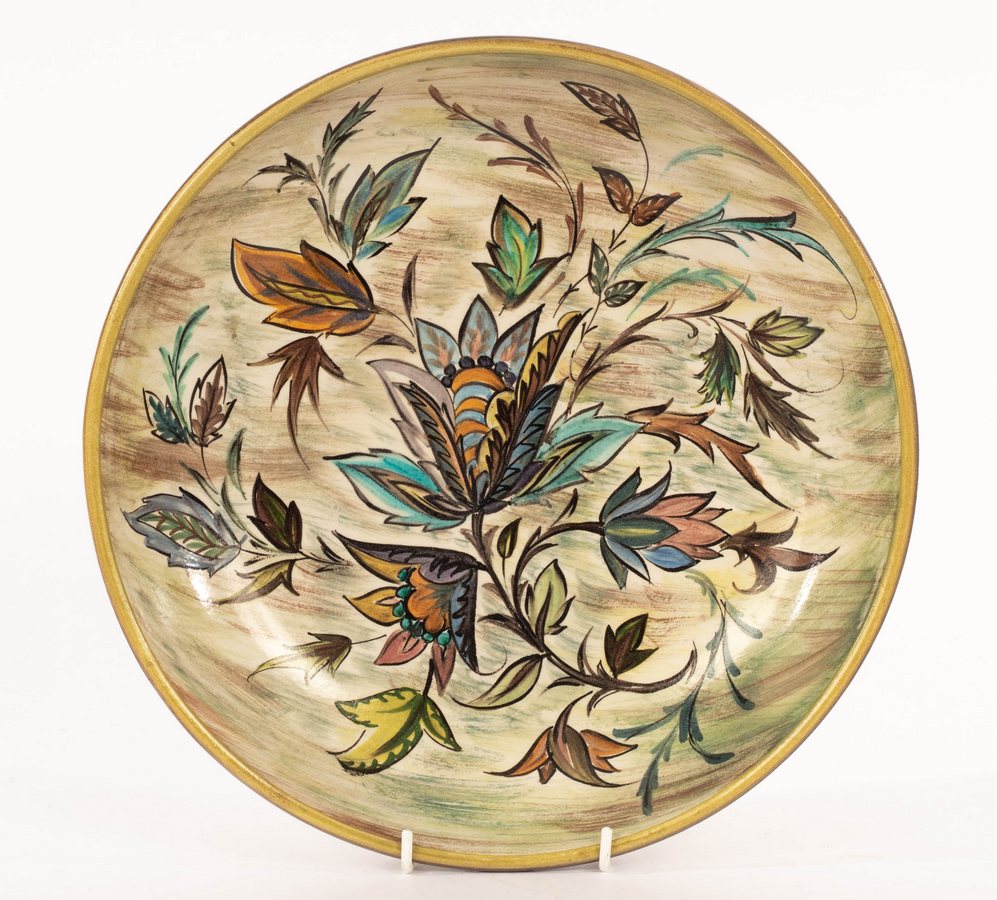 Glyn Colledge (1922-2000), a large pottery bowl with floral decoration to a green and grey ground,