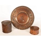 An Arts & Crafts hammered copper charger, decorated border of grapes and vines, 29.