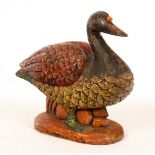 A 20th Century carved and painted wooden duck, possibly Scandinavian, 43cm wide,