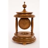 Ian King (20th Century), a lacewood carved watch stand, signed to base,