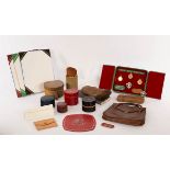 Theo Merrett, a group of hand tooled leatherwork, including handbag, boxes, purses and bookends,
