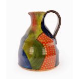 John Pollex (born 1941)/Large slipware jug with polychrome patchwork decoration, impressed JP mark,