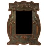 An Art Nouveau copper frame with mirror, easel back missing,